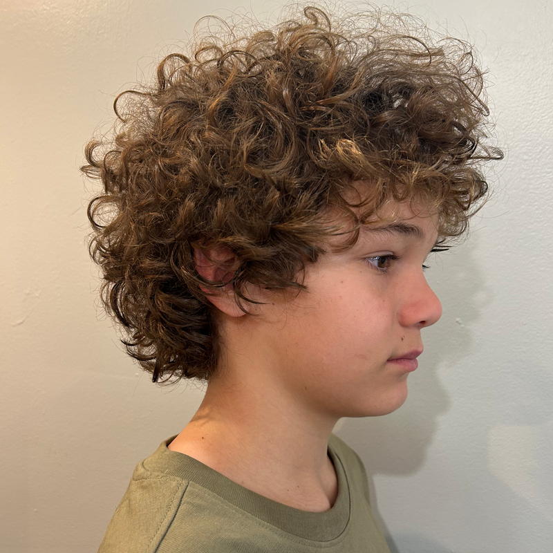 medium scissor cut on curly hair by Ivano, Land of Barbers Greenpoint